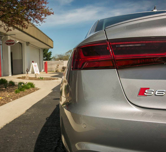 Silver Audi S6 Sedan Outside Our Garage
