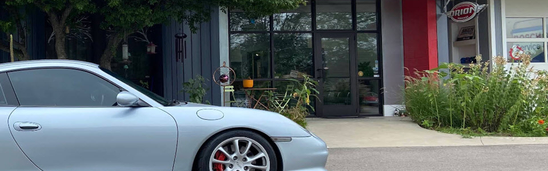 Silver Porsche 911 Outside Our Garage